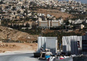 Israel approves construction of new homes in capital, as violence flares