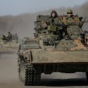 Members of the Ukrainian armed forces ride military vehicles near Artemivsk