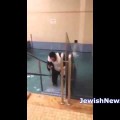 Man Tries to Hang Clock, Falls into Mikveh Instead