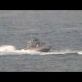 US warship fires warning shots at Iranian boats